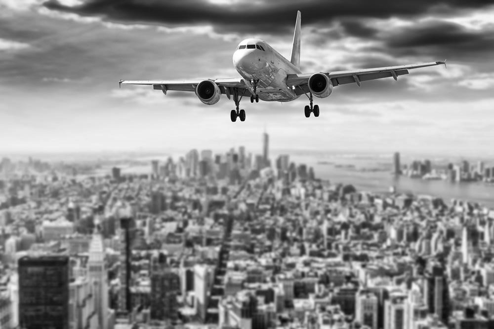 Airplane Over New York City Wallpaper Wall Mural