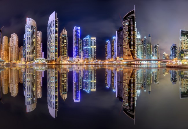 Wall Mural Blue nights Dubai - skyline with skyscrapers and reflection in  water - Other cities - Cities - Wall Murals